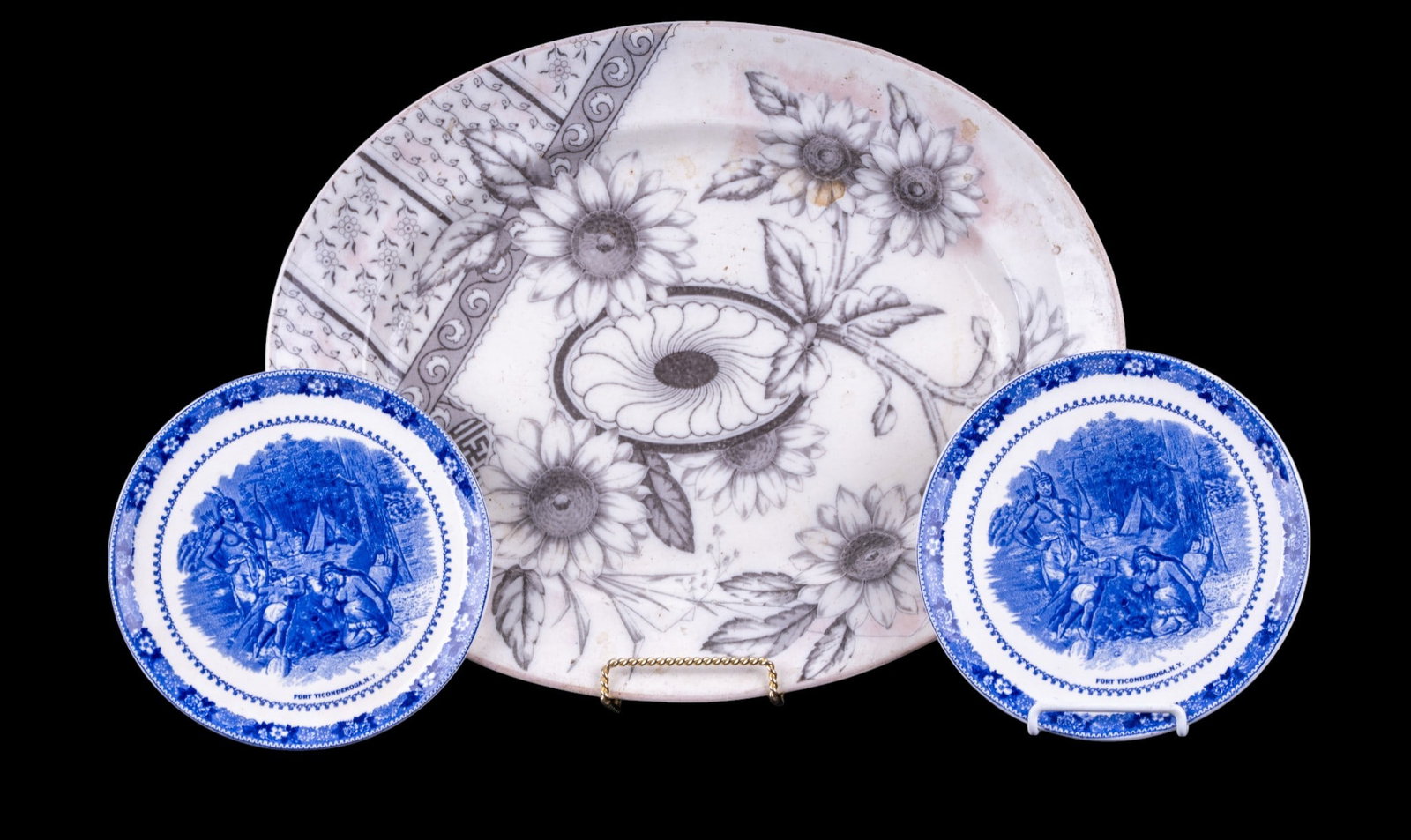 Historic Blue Native Transferware & Antique Platte: Includes two english blue ware plates measuring aprox. 7.75 inches in diameter marked "Johnson Bros. England from the mid 20th century & a large oval platter marked "Pinder Bourne" on outside of marki