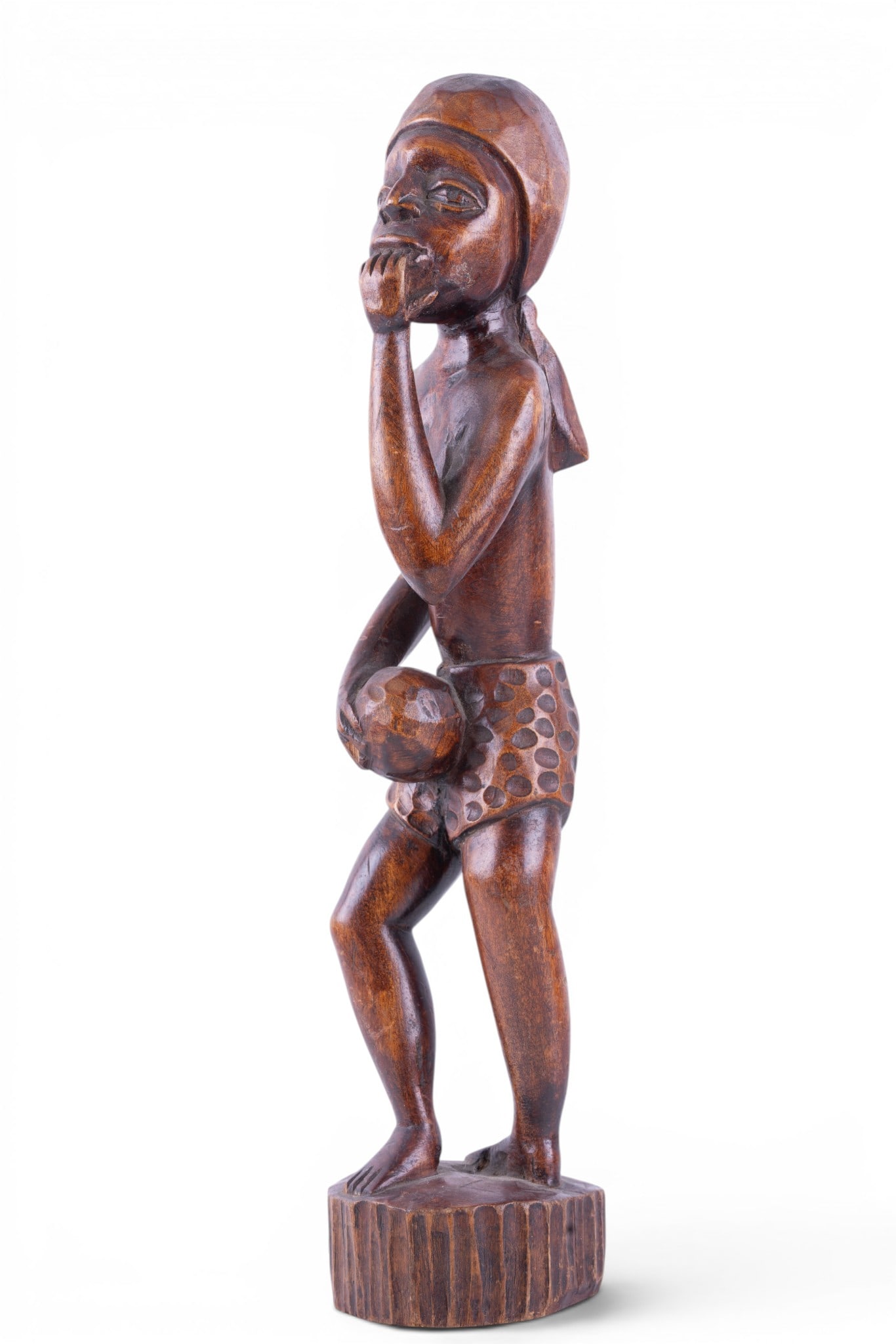 Vintage African Hand-Carved Figural Sculpture: Vintage mid-20th century hand-carved African hardwood figural sculpture depicting a standing male figure in contemplative pose with hand resting beneath the chin. Measures approx. 17.25" H.