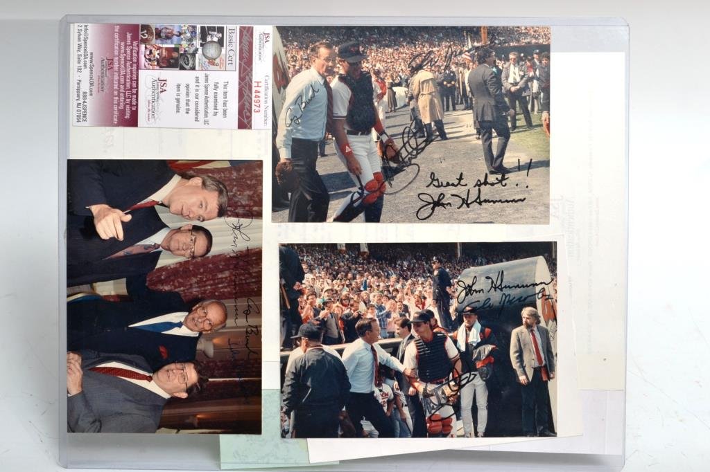 Three Authentic Signed Photos of George H.W. Bush: Three signed photographs, two show him preparing to throw out the first pitch at a Baltimore Orioles game (one also signed by Orioles Catcher Mickey Tettleton) and the third is a photograph signed by 