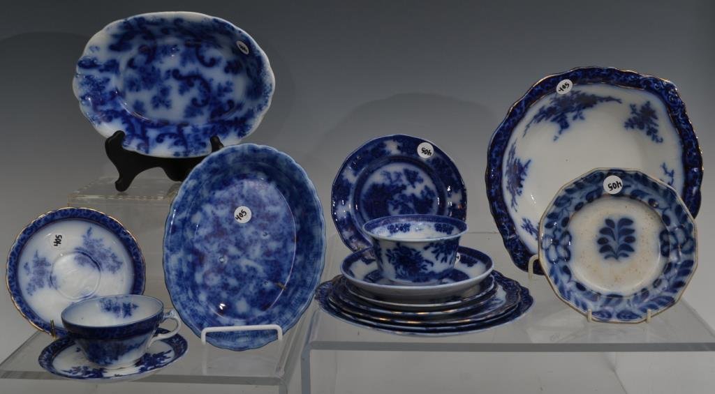 Grouping of Flow Blue: Grouping of Flow Blue by various makers in various patterns, including; a 10" open vegetable, a 9.5" open vegetable, a 9" open vegetable, a cup and saucer, two 6.25" saucers, three 6" saucers, 6.5" pl