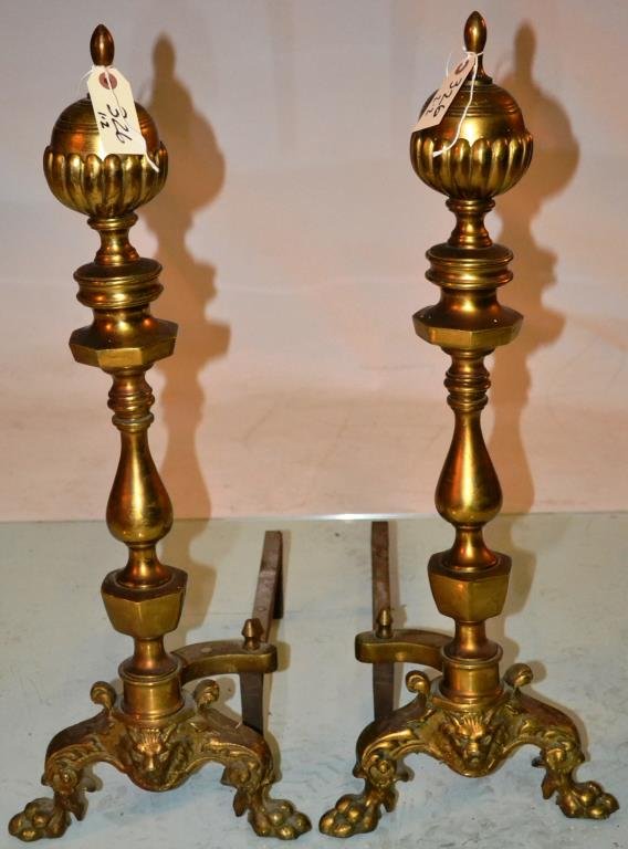 Pair of Cast Brass Andirons With Cast Griffons and: Pair of cast Brass antique style Andirons, bearing cast Griffons and over paw feet, measure 27" h