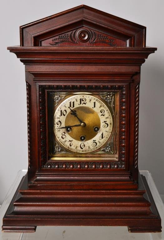 Unghans German Mantle Clock: Unghans German Mantle clock with a brass, porcelain and silvered face, marked on the bottom JB-05 , standing 18"h x 13.25"w x 10"d