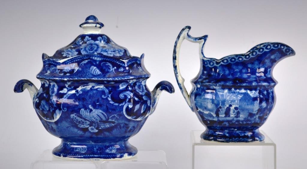 19th Century Blue Transfer Staffordshire Grouping: Grouping of 19th Century Blue Transfer Staffordshire including a sugar with seashell pattern, and a creamer with European townscape; sugar is 7"h