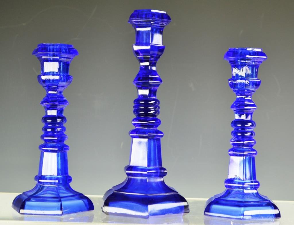 Three Blue 19th C Sandwich Glass Candlesticks: Three Blue 19th C Sandwich Glass Candlesticks with octagonal base and socket, largest is 9.5"h