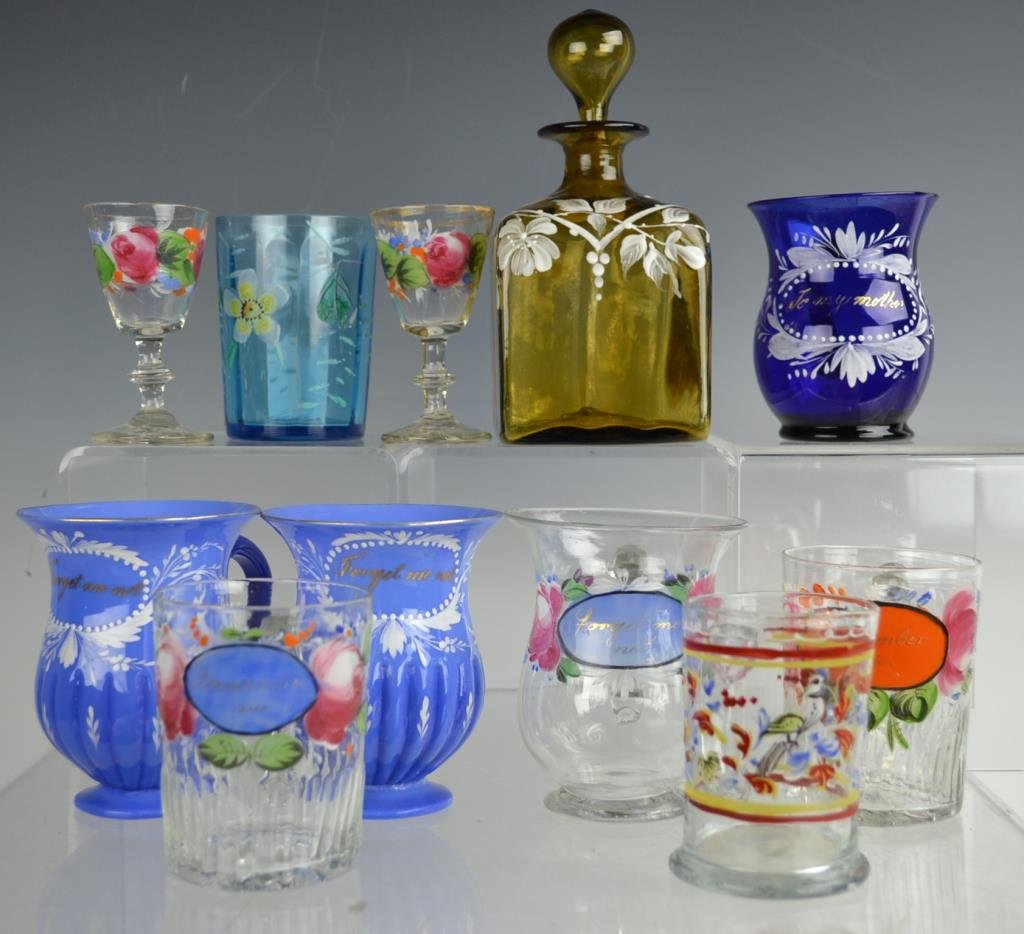 Eight pieces of 19th C Enameled Glass: 19th C enameled glass grouping, including; two beakers "Remember Me" in design, two cordials, and two mugs "Forget me not" in design, pair of blue "Forget me not" mugs, and a cobalt blue mug "To my mo