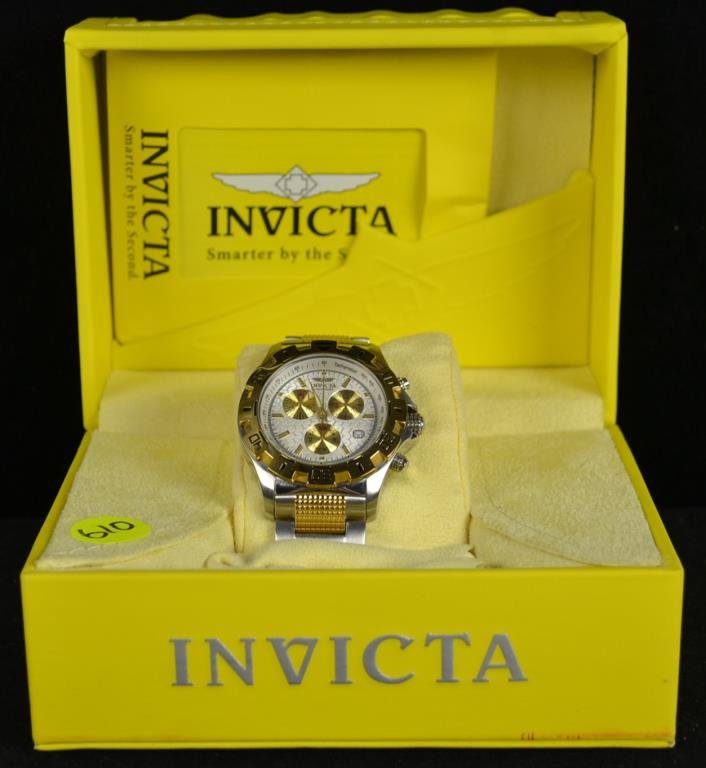 Invicta Specialty Gents Watch: Invicta specialty gents wrist watch tritnite glow, all stainless steel, Tritnite night glow, Swiss parts chronograph, 100M water resistant model # 57000, silver and gold toned wrist band with a white