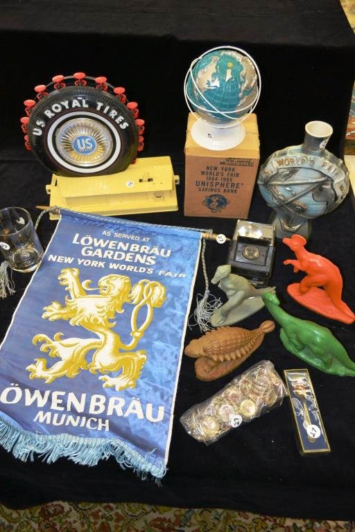 Advertising Souvenirs from the 1964 New York World: Advertising souvenirs from the 1964 New York Worlds Fair, including; Lowenbrau banner, Royal Tires Ferris wheel, Jim Beam decanter (no top) four Sinclair Dinoland wax dinosaurs, a Kodak camera, New Yo