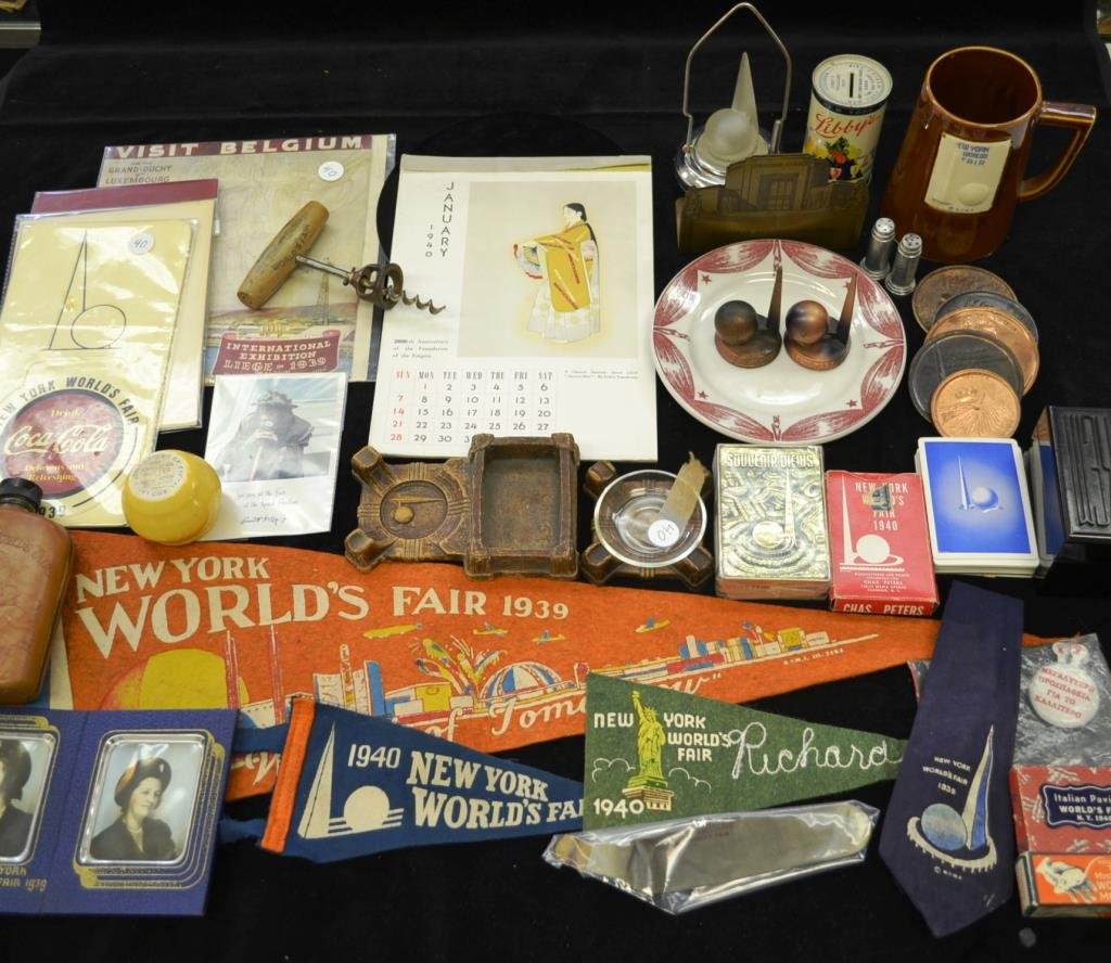 Souvenirs of the 1939 New York Worlds Fair: Large grouping of souvenirs from the 1939 New York Worlds Fair including; Coca Cola 3D Coaster, flask, ceramic mug, clown photo, brass bookends, Kem playing cards (in case) three decks of cards, five