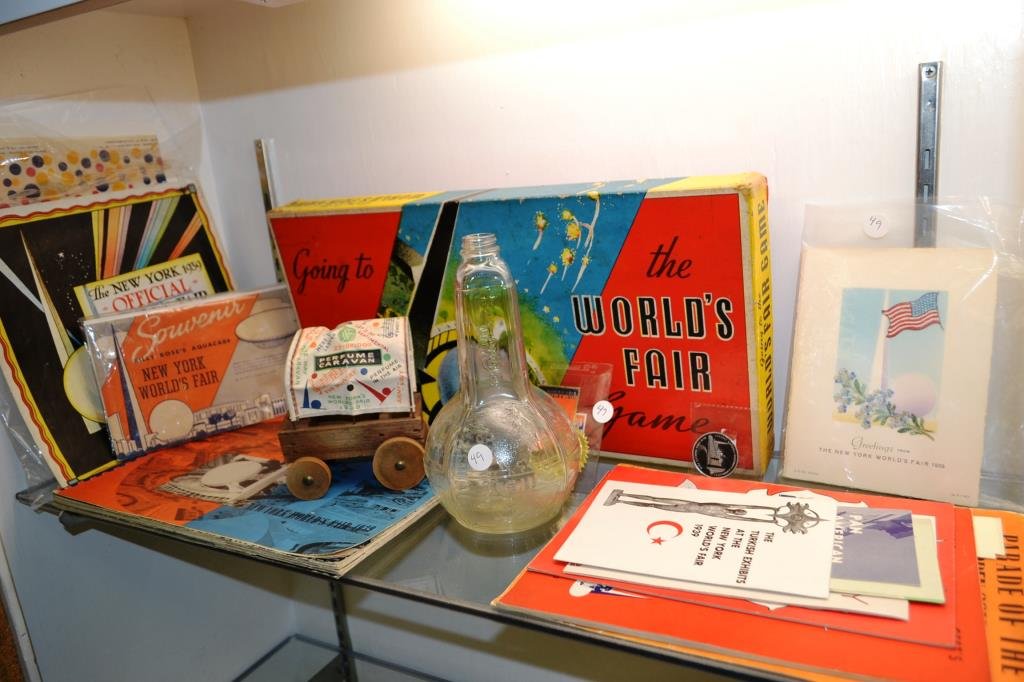 Grouping of "1939 New York World's Fair: including "Going to the World's Fair" game, official souvenir book, official pictorial map, "1939 New York World's Fair Midget Town" pamphlet, foreign pavilion pamphlets, a World's Fair Wonder bread p
