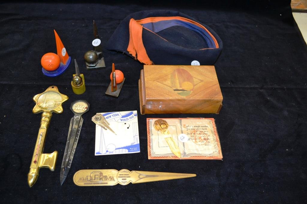 1940 World's Fair Souvenir Items: Souvenir grouping includes paperweights in the Tryon and Perisphere design (one is cast metal, has slight cracks to the Perisphere) second has a Bakelite base, a thermometer, a salt and pepper, two th