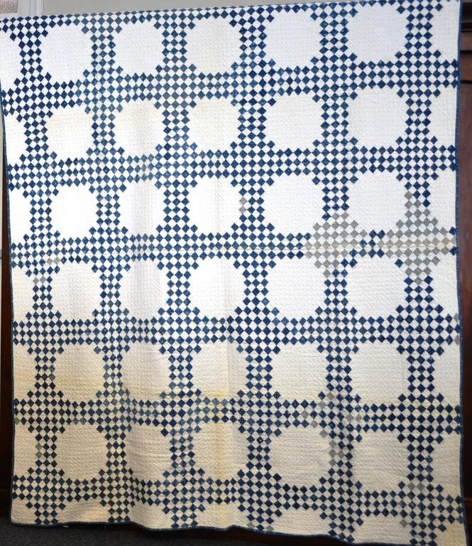 Blue and White Triple Irish Chain Quilt, Late 19th: Blue and white triple Irish chain quilt, some minor stains, measures 62" x 76"