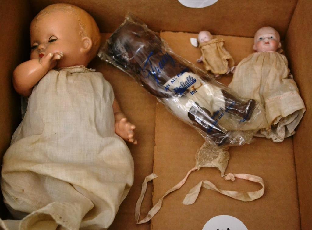 Four Early Dolls: Four early dolls; Effanbee Patsy baby with sleeper eyes (in good condition) along with an early German bisque doll in original dress, and a wee tiny bisque doll, and a Reliable Canadian black baby dol