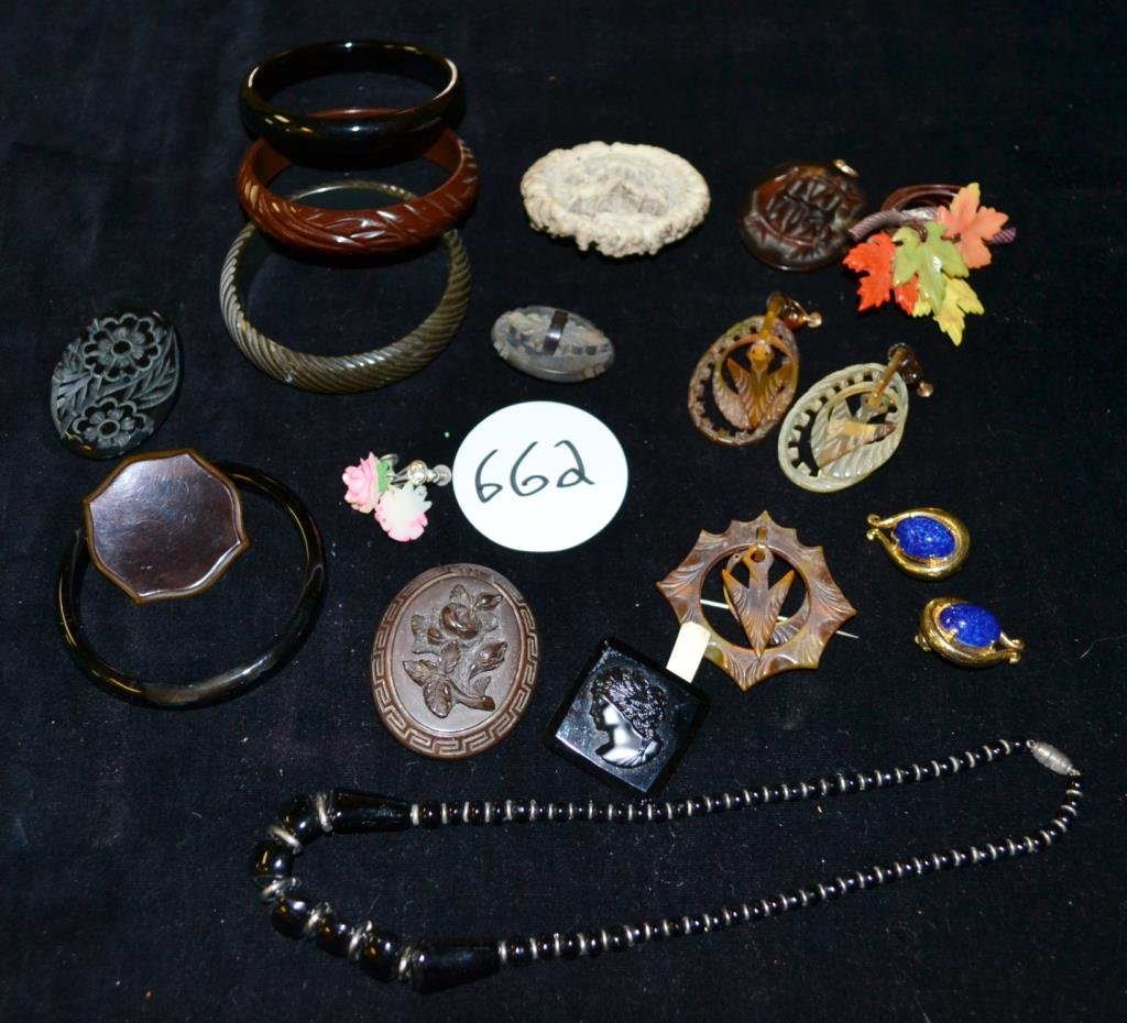 Tray of jewelry.: Tray full of bakelite and other early plastics including bangles, pins and more. Also includes a pair of Joseph Mazer earrings.