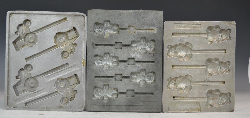 Three Candy Molds: Three stick-candy molds; tractor, a bear, and a boy bear marked Apollo Tulsa OK 74015 Food APP MAT 977