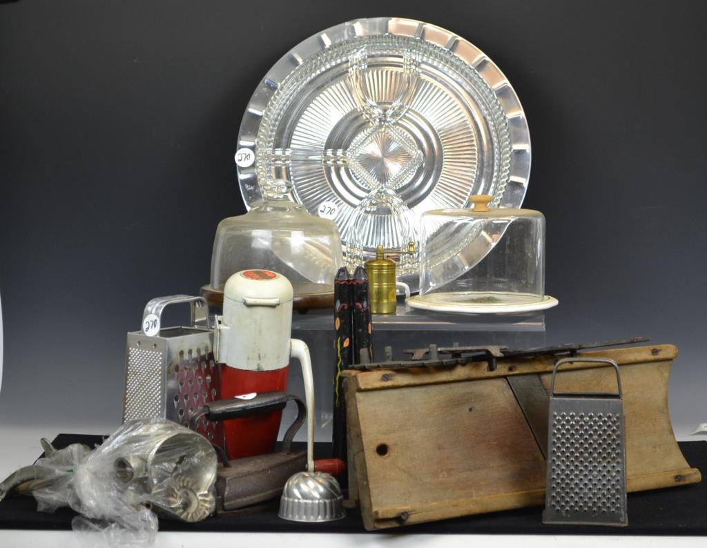 Kitchenware Grouping: Kitchenware grouping includes; a tole painted candle mold, a number 6 Sadiron with trivet, two slaw boards, two graters (larger one is Bronco Alumanium) meat grinder, pudding mold, three additional ir