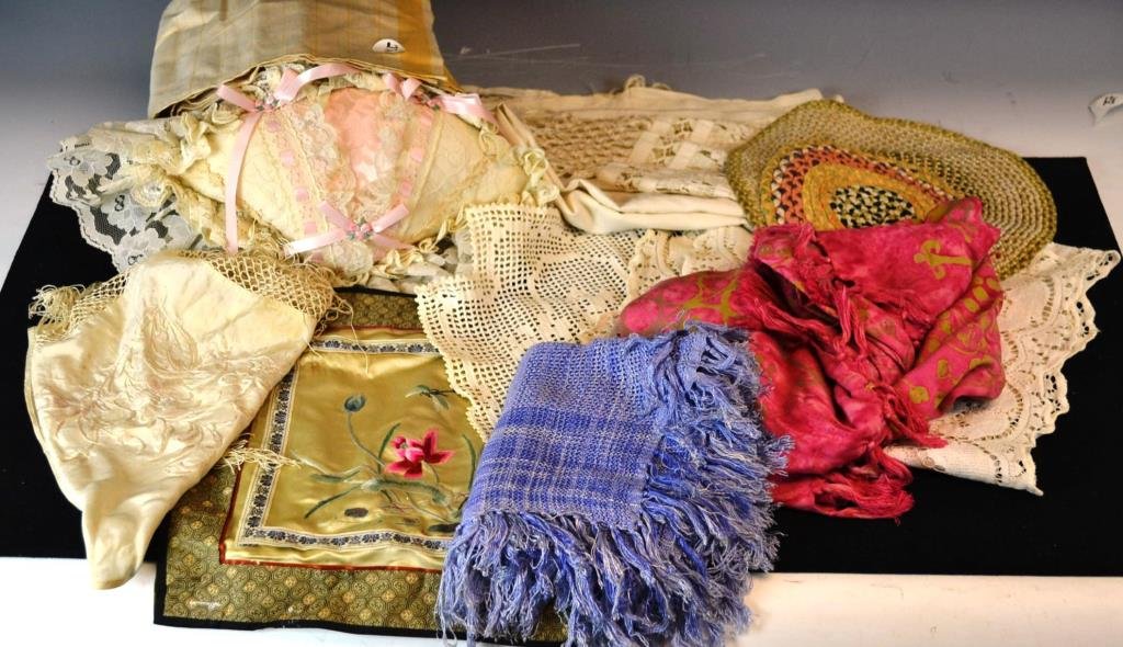 Grouping of Various Cloth Items: Grouping of cloth items including; two dollhouse scale braided rugs, three woven table runners, a silk head covering, a tatted piece with flowers and basket pattern, a silk embroidery of dragonflies a