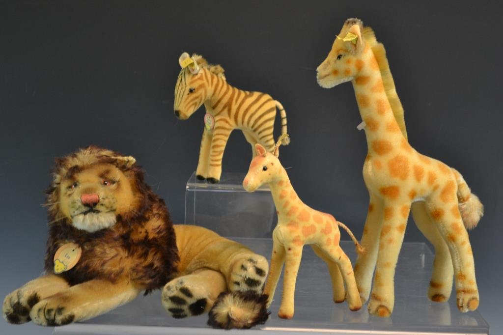Steiff Toy Grouping: Steiff toys including two giraffe (one 6.5" the other 13") Zebra and a Steiff Lion with damage to ears (they were nibbled) Giraffe and Zebra have buttons, ribbons, and tags; Lion has a tag, no button,
