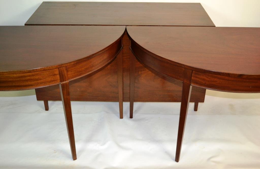 19th C Mahogany Hepplewhite Dining Table: 19th C Mahogany Hepplewhite dropleaf dining table with two D ends, one board tops over molded apron and tapered feet, extra leaves, measures 28.5"H x 67"W (closed - measures 84" open) x 49.5"D