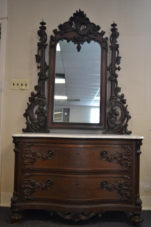 High Style Victorian Marble Top Dresser and Mirror: High style Victorian with heavily carved Cornicopia, harps and drawers, overall good condition with the exception of one wooden mirror pin / threaded dowel; measures 82"H x 48"W x 22"D