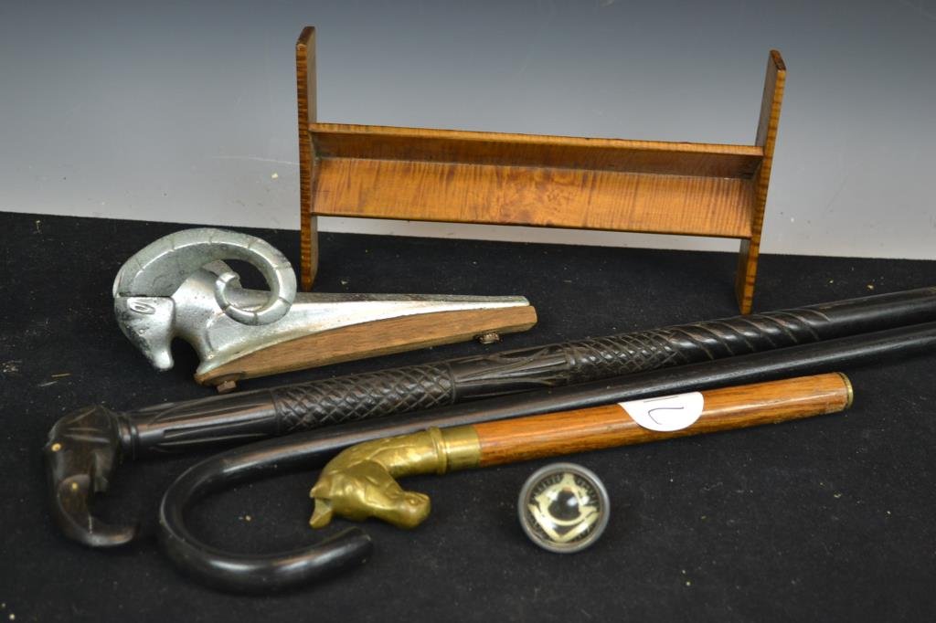 Grouping of Decorative Items: Grouping of decorative including a cane top with Masonic Symbol, a cast Ram which appears to be a hood ornament, brass horse head cane top on short display staff, a carved ebony cane with elephant fig