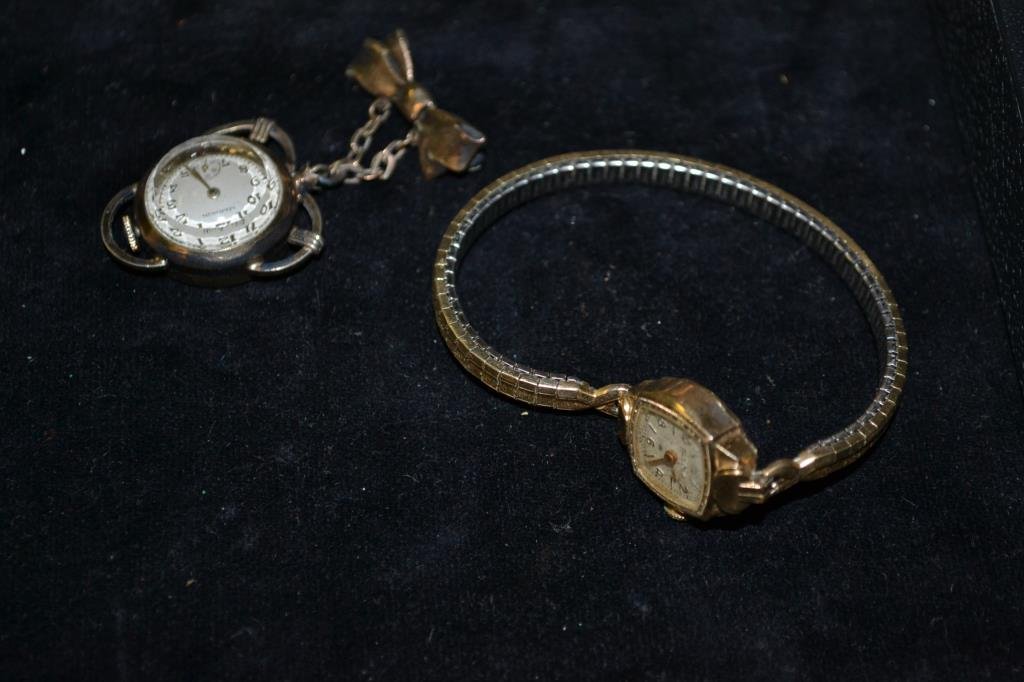 Watch Lot: Watch lot includes two vintage Swatch watches (in original packaging) and another watch by Aroyn Rothstein, lot also includes 2 10K gold fill watches (Bulova ladies wristwatch) the other is pin on wat