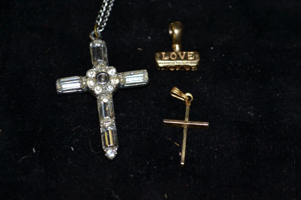 Costume Necklace Lot: Costume necklace lot includes many vintage rhinestone pieces, three midcentury metal belts, a gryphon locket in the form of a book, a secret window cross, a gold filled cross, and many more