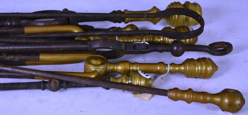 Grouping of 19th C Fireplace Tools: Grouping of fireplace tools including; six tongs, one rake, one shovel, and a poker with a 90 degree angle
