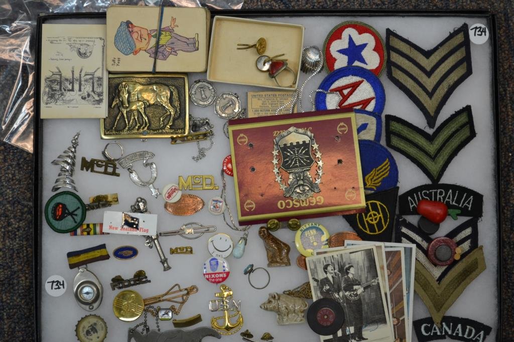 Collection of Military Insignia: Collection of personal Military insignia and boyhood collectables including; a Captain Railston straight shooter badge, a Frank Robinson All Stars Coke bottle cap, Beetles color cards, Nixon pin, Camp