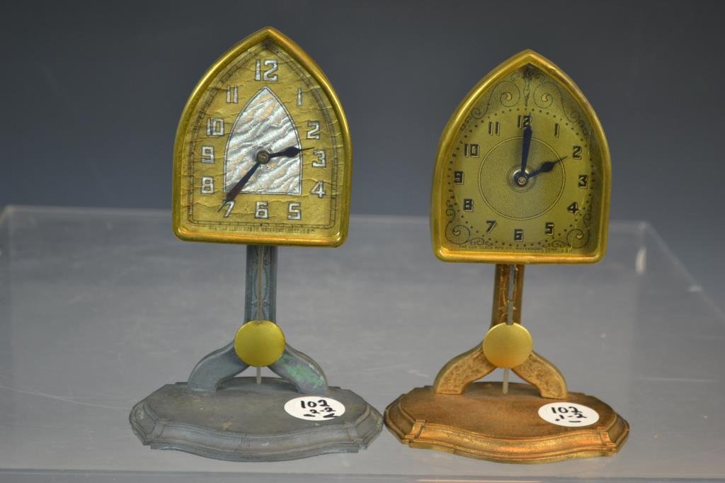 Two Lux Pendulette Clocks: Two Lux Pendulette clocks with beehive faces, one with a green base, the other metal, each standing 6.75"H