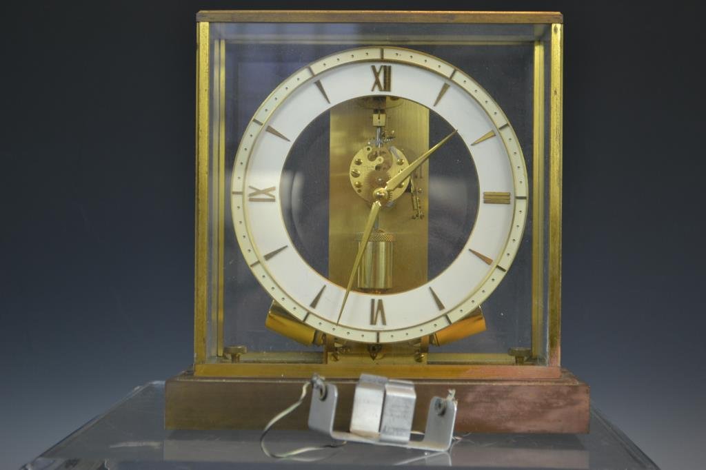 Junghans Battery Electro Magnet Pendulum Clock: Junghans Ato brass and glass clock by Henry Coehler, marked "Junghans Ato" reverse painted dial. Visible movement marked "Henry Coehler Co. Made in Germany". Magnetic to and fro pendulum, standing app