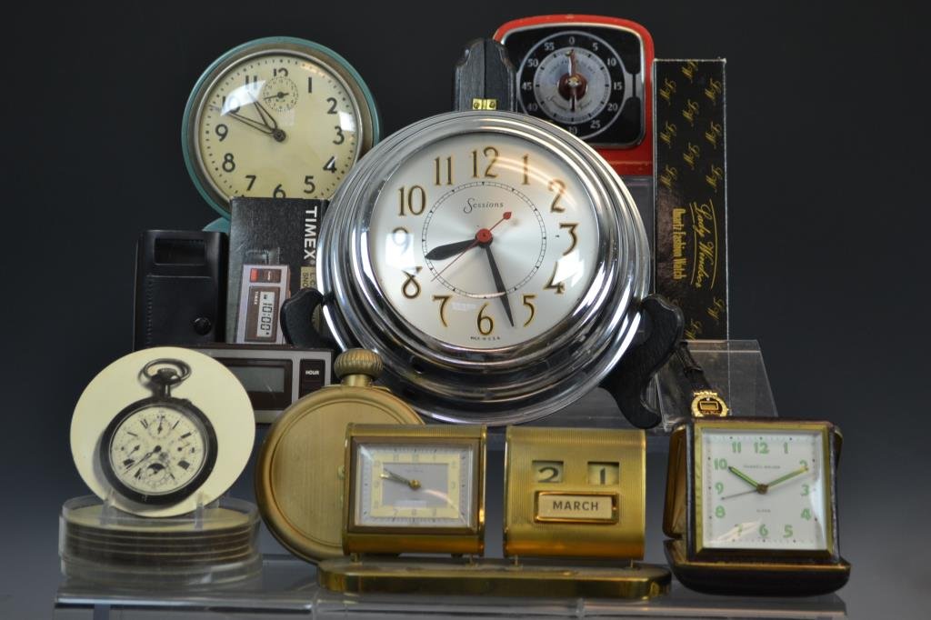 Collection of Alarm Clocks, Timers and Accessories: Collection of travel alarm clocks, one timer, and accessories including; a Timex L.C.D. Digital travel alarm in original box with documentation) travel alarm clocks manufactured by Phinney-Walker, Ren