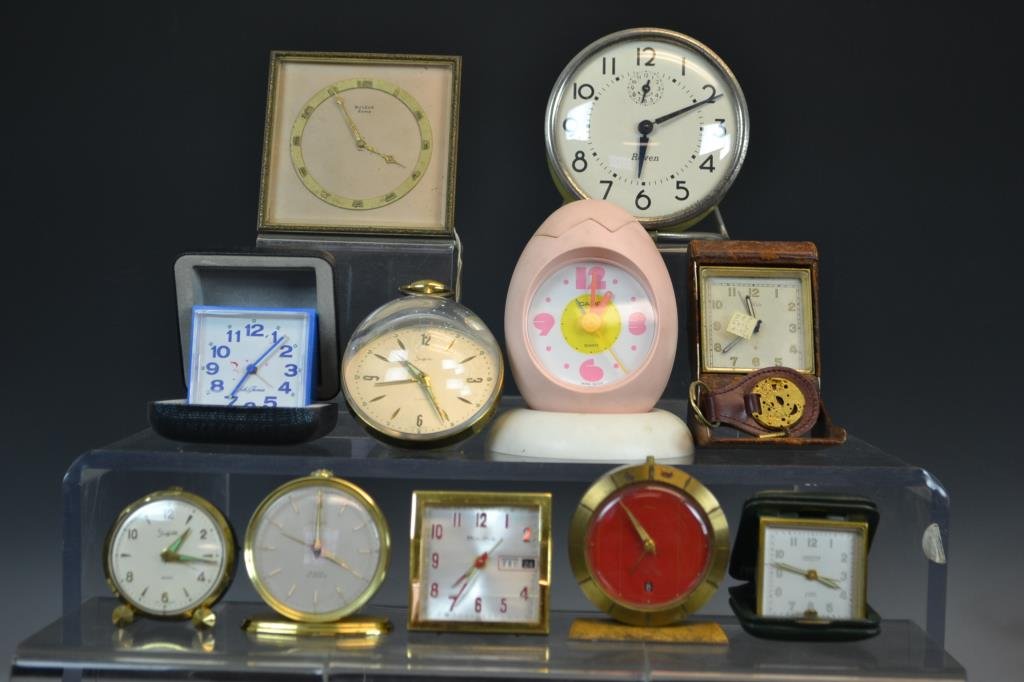 Collection of Novelty and Travel Alarm Clocks: Collection of novelty and travel alarm clocks including travel alarms by Turler (8 day), Looping, Bulova, a Bulova 8 day, a battery operated Casio egg timer (in the form of an egg, battery operated) L