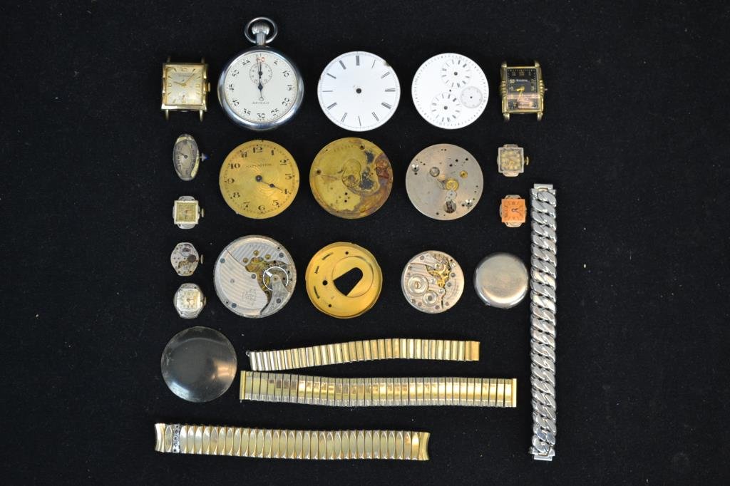 Watch Movements, Components, and Watch Grouping: Grouping consists of men's and women's items including; a Bulova gold filled men's wristwatch with black dial, Wittnauer Men's Wristwatch with damaged dial and no crystal, Didisheim ladies wristwatch