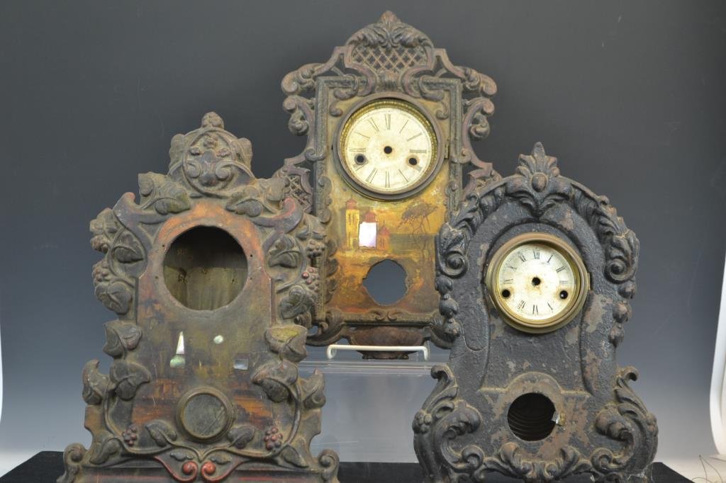 Three Mid 19thC Cast Iron Clock Faces: Three cast iron clock faces circa 1860; two with wooden clock boxes, (including one marked Bristol) in as-found condition