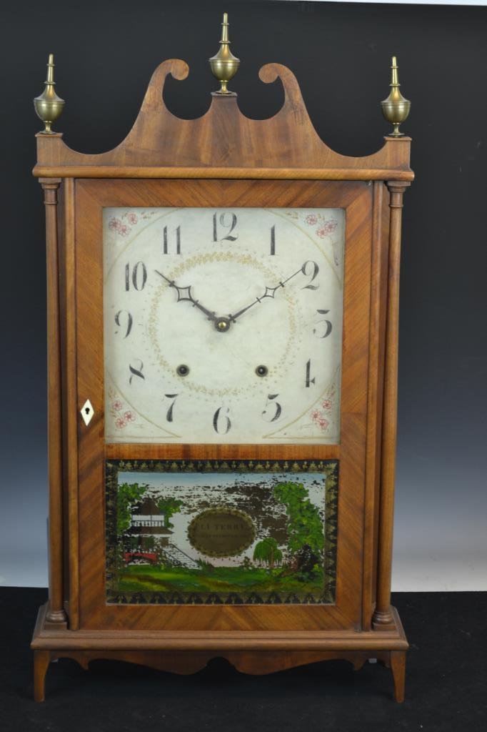 Eli Terry & Sons Pillar and Scroll Clock: Eli Terry & Sons Pillar and Scroll clock - has original door key, pendulum, label, crank, three finials (also includes a complete set of replacement finials) - no weights, some loss to reverse paintin