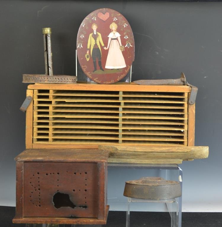 Antique Decorative Lot: Decorative lot including a Wooden footwarmer, a carved wooden hull to a miniature sailing vessel, a PA German antique style Bride's Box, a Flatiron, a RR spike, and a wooden box