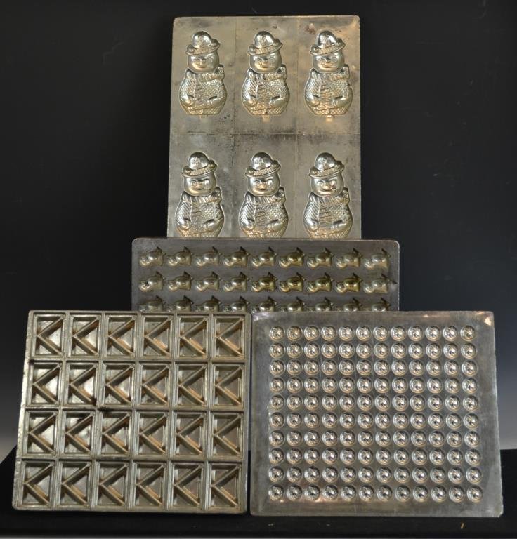 Early Sheet Chocolate Mold: Early sheet chocolate mold in the form of Easter Chicks, mold measures appx 7" x 18", along with a candy round mold, an old fashioned square candy mold, and a sheet mold with the forms of Snowmen