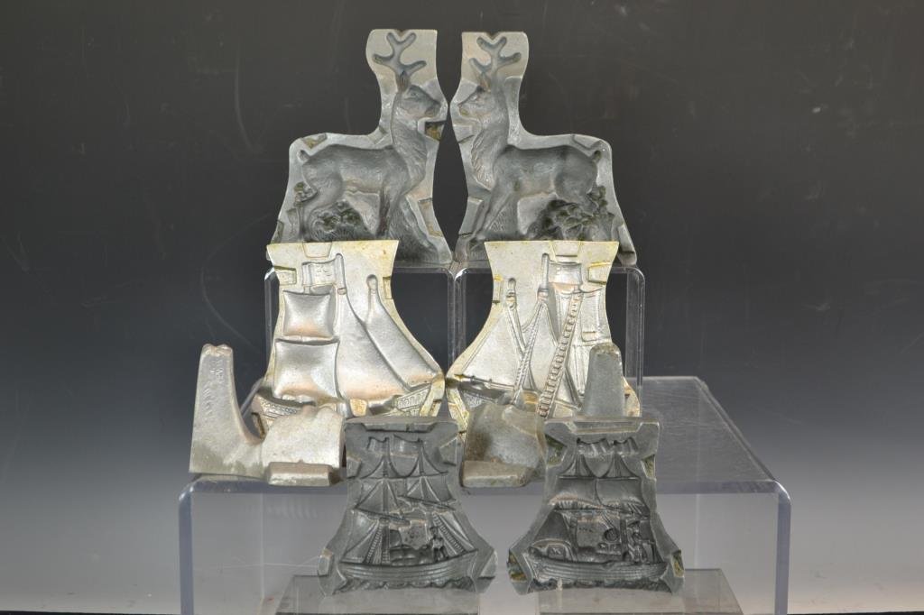 Three Clear Toy Candy Molds: Clear Toy Candy Molds in the form of; a sailing ship, another sailing ship, and a reindeer