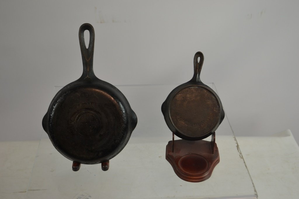Two Miniature Vintage Cast Iron Frying Pans: Two miniature vintage cast iron frying pans ncluding; a Wagner which appears to be a #1, and a Grizwold #2 frying pan