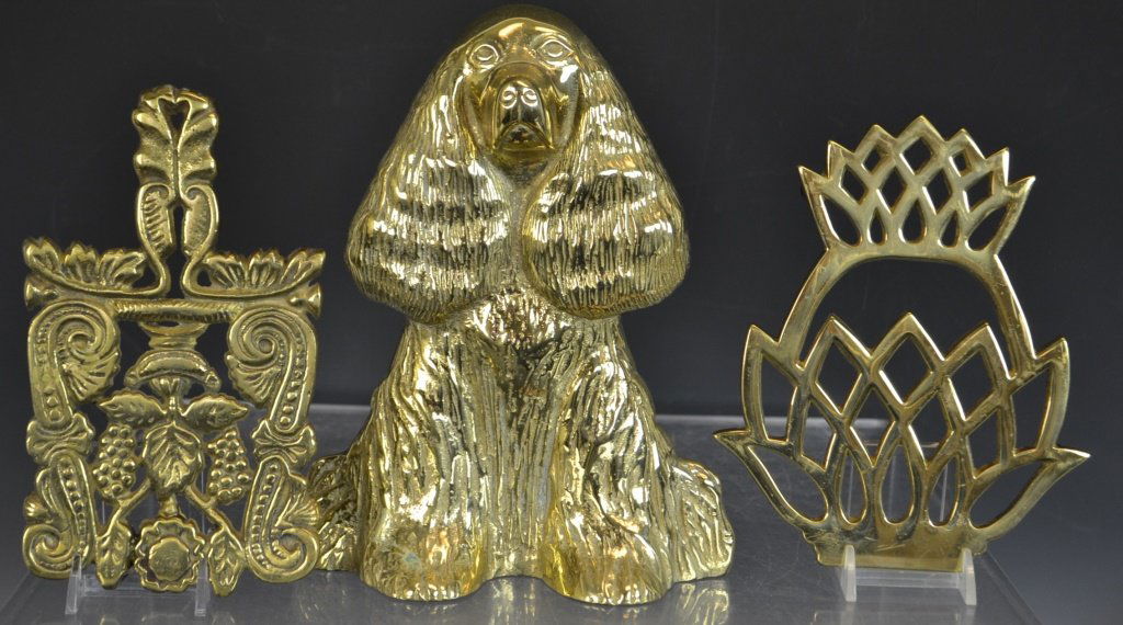 Brass Doorstop and Trivets: Brass doorstop in the form of a Cocker Spaniel, and two brass trivets one in the form of a Pineapple and the other a floral decoration