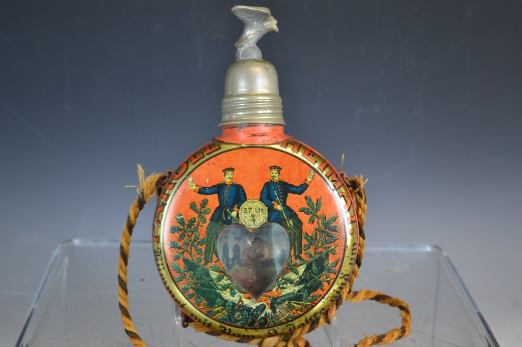 German Antique Ceremonial Canteen: German Antique ceremonial canteen, marked Rservist Otto, with eagle finial, for the Wittich 83rd Reservists, canteen has a clear plate showing the internal scene and German dialogue, canteen measuring