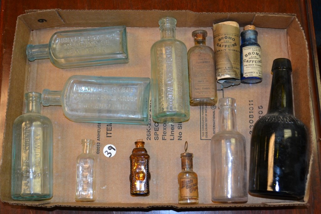 Grouping of Early Apothecary Bottles: Grouping of early bottles including; a Bromo caffiene with label and original box (1906) DelAvaus Syrup for Whooping Cough and Croup, Atwoods Jaundice Bitters (formerly made for Moses Atwoods), D.D.D.