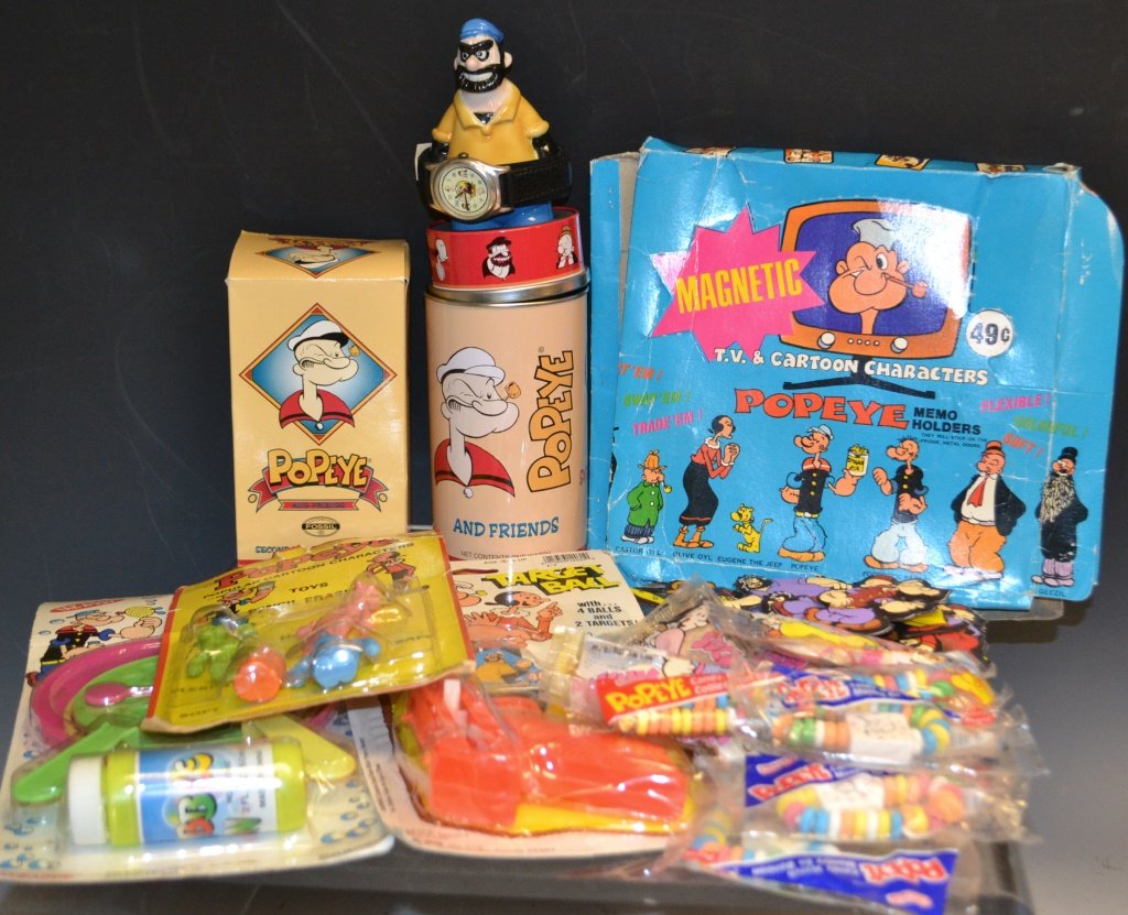 Grouping of Popeye Collectibles: Grouping of Popeye collectibles including; Popeye Target ball guns, pencil and erasers, giant bubble wand, refrigerator magnets, and a Popeye Fossil watch