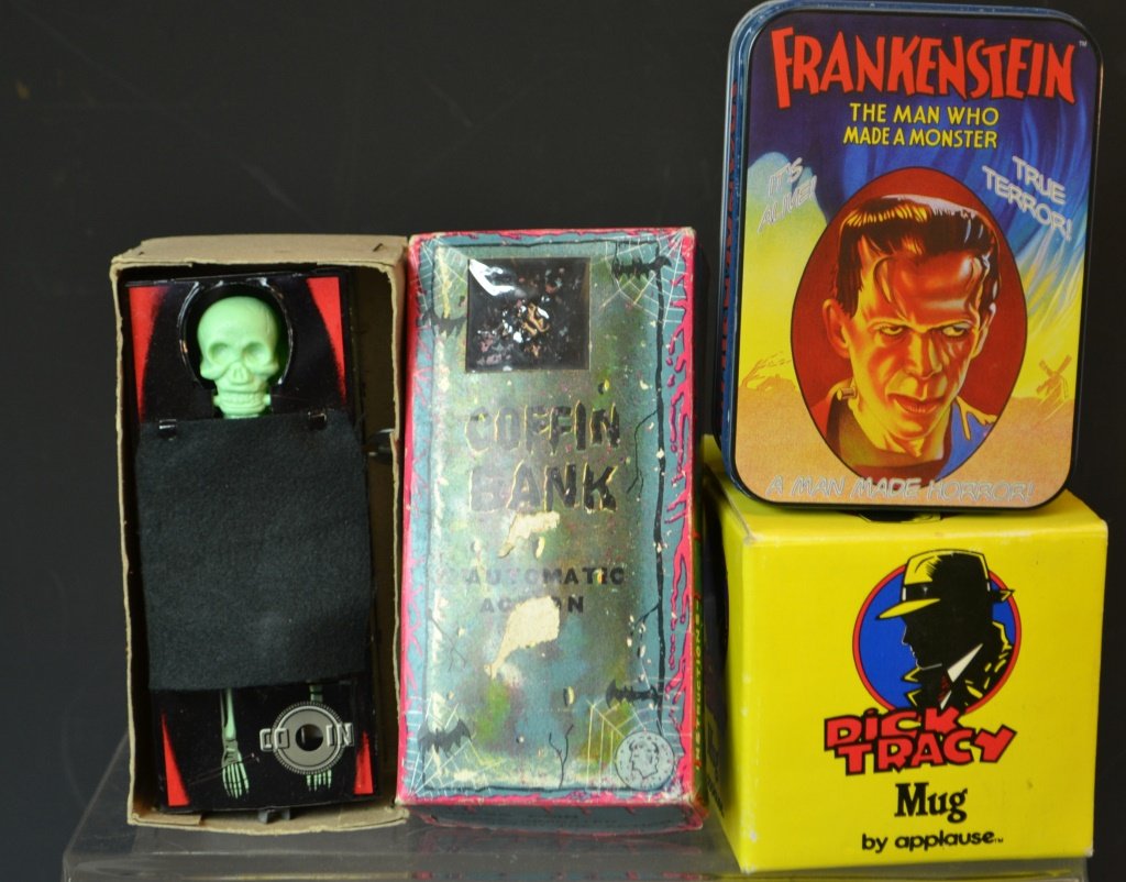 Grouping Of Collectibles & Novelty Items: Grouping of collectibles & novelty items including; Coffin Bank, in original box, Dick Tracey mug by Applause in original box, and a Frankenstein watch by Fossil in original container