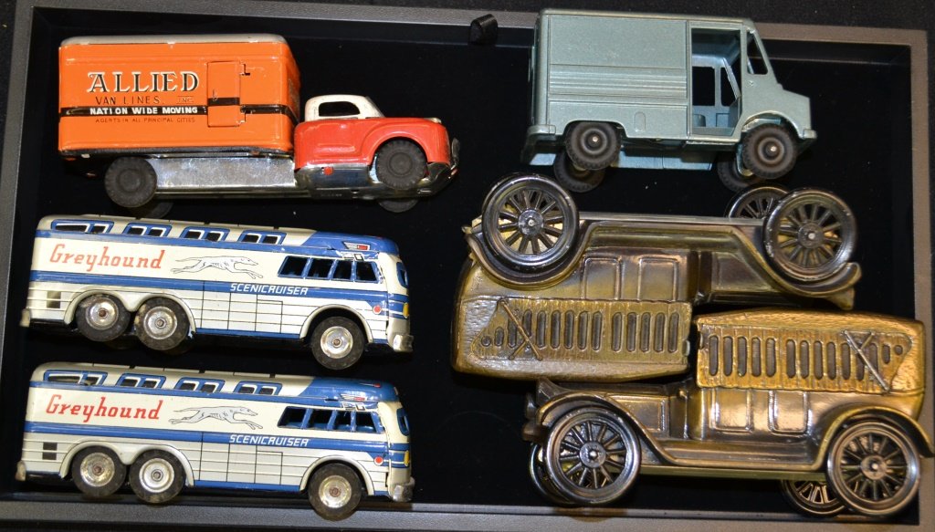 Grouping of Pressed Tin Friction Vehicles & Banks: Grouping of Pressed Tin friction vehicles & banks includes; 2 Greyhound friction buses, Allied Vanlines friction truck, & 3 cast metal banks
