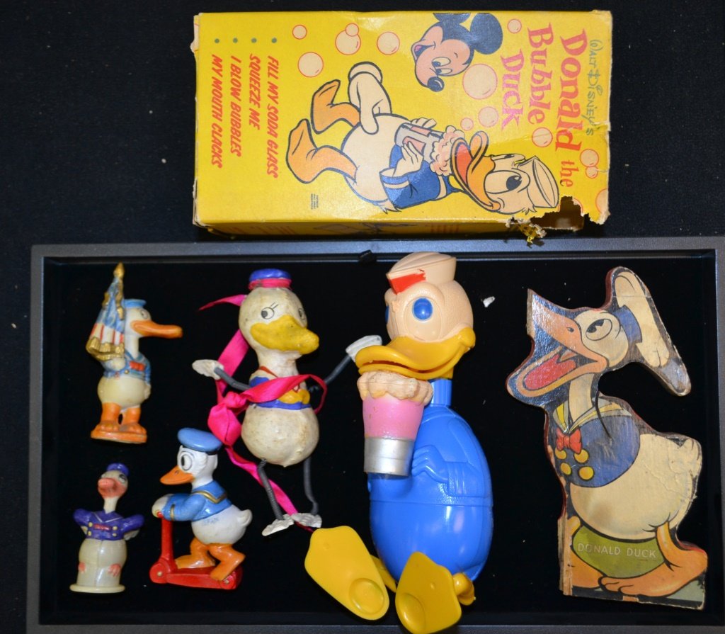 Collection of Donald Duck Toys: Collection of Donald Duck Toys including Donald the Bubble Duck, a piece of a Fisher Price Toy, 3 Japanese made figures, & a composite figure with spring arms and legs (chipping throughout).