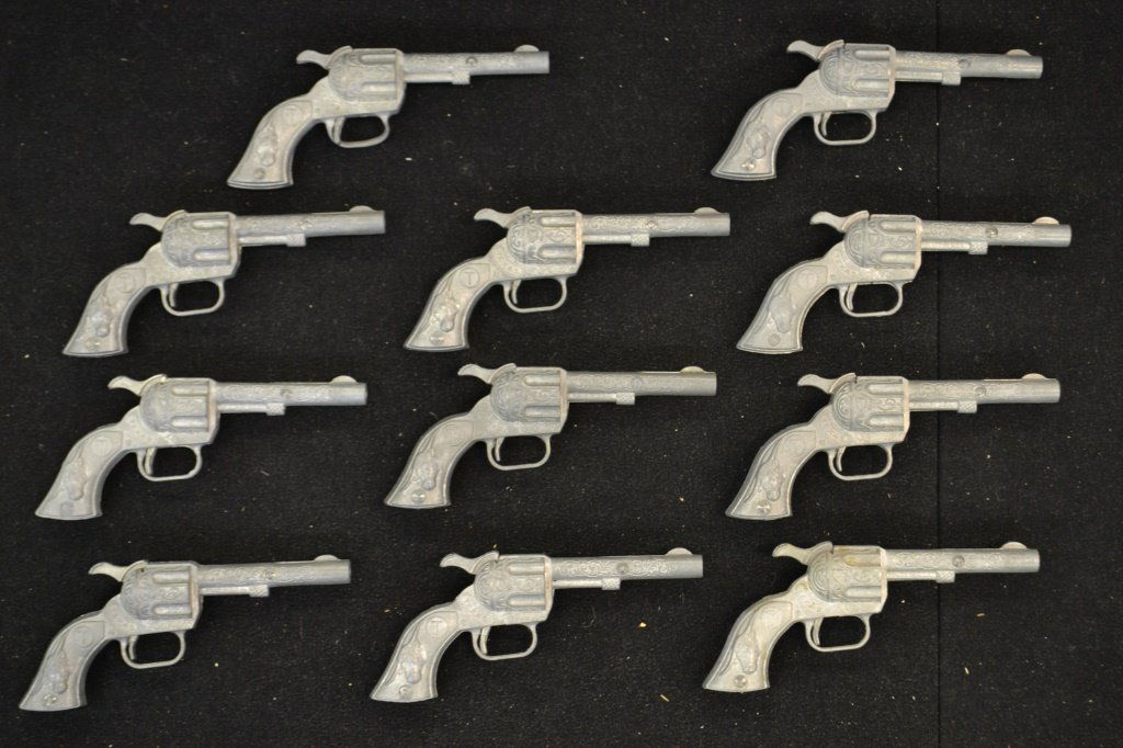 Eleven Texas Cap Guns: Grouping of eleven Texas cap guns, marked "made in the USA" with circle T and steer on grip, attributed to Hubley each measure 5.5"L