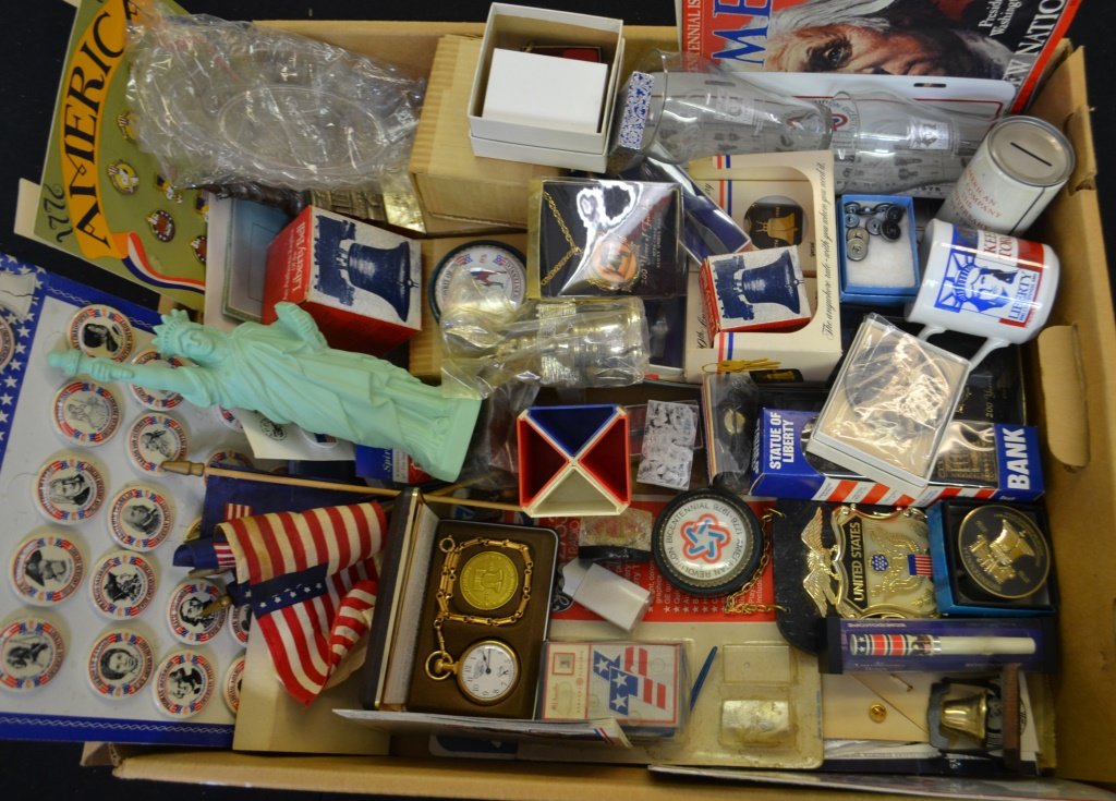 Large Collection Of American Bicentennial Souvenir: Bicentennial souvenirs including, 1976 Aviva Snoopy Pin display, Retail Display pin back card, American Flag, 3 unopened spirit of 76 paper weights, portable 1976 radio, bicentennial pocket watch set 