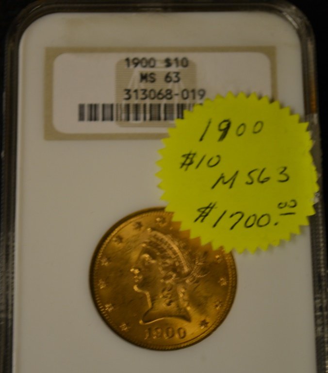 1900 $10 Dollar Gold Eagle Coin MS 63: 1900 $10 Dollar Gold Eagle Coin MS 63 graded by numismatic guaranteed corporation of America. *Note* Due to fraudulent transactions Keystone Auctions may require cash, money-order or wire transfers fo