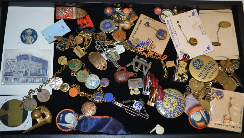 Grouping Of World Fair Items: Grouping Of World Fair Items including: " Little Miss Junkett" button pin, Advertising buttons, adverting pins, charm bracelets, and other misc items
